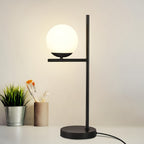 Lampe de chevet globe en verre opalin sur tige noire ou dorée, E27