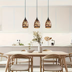 Suspension cloche en métal noir ajouré motif nid, intérieur cuivré