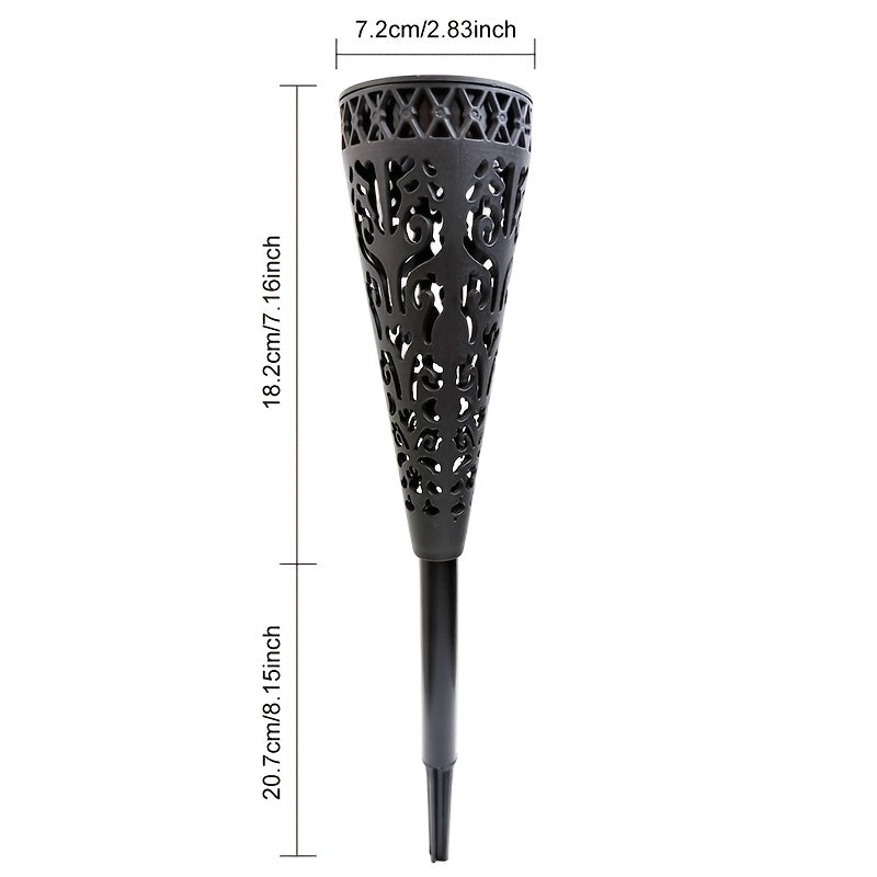 Lampe solaire torche ajourée noire, ombres florales sur l'allée