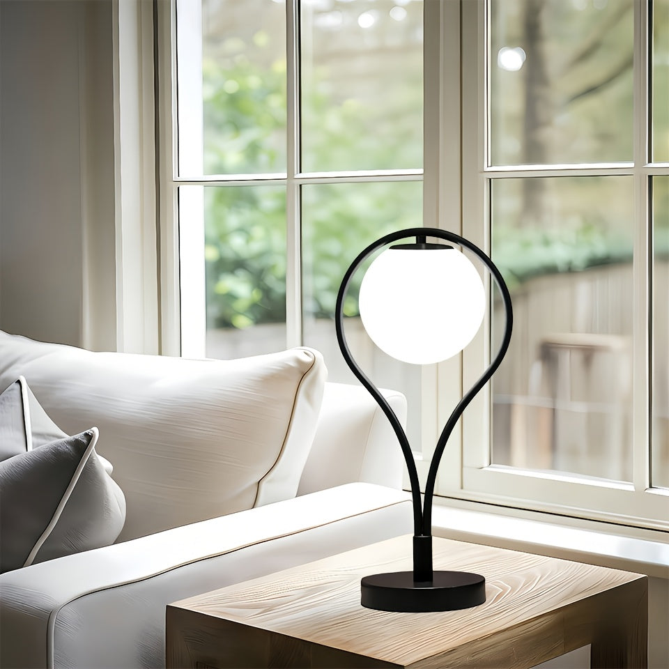 Lampe de chevet noire, globe en verre opalin dans un arceau
