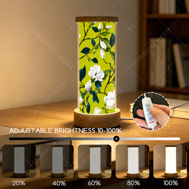 Veilleuse cylindre en acrylique à magnolias sur fond vert anis