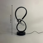 Lampe à poser blanche en ruban LED noué, sculpture lumineuse