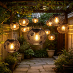 Suspension solaire boule grillagée noire, fleurs et papillons IP65