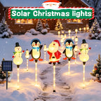 Lampe solaire de Noël à piquets, bonhommes de neige et pingouins