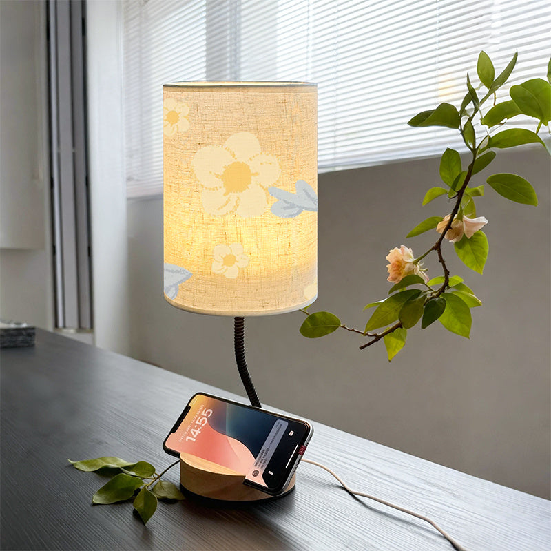 Lampe fleurie au col orientable et socle en bois