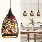 Suspension cloche en métal noir ajouré motif nid, intérieur cuivré