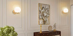 Applique murale boule opaline sur tige dorée, douille E27