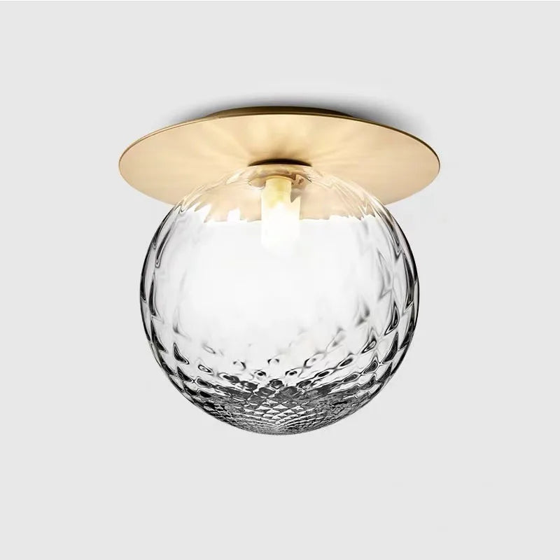 Boule de verre opale ou bullé sous disque doré