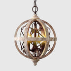 Lustre boule en bois patiné, 3 chandelles E14 et pampilles