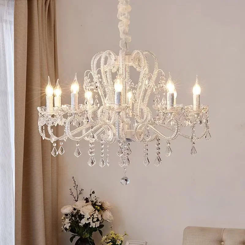 Lustre en cristal à bougies et bras en volutes