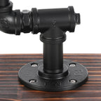 Lampe à poser industrielle en tuyaux de fer noir, cage et socle bois