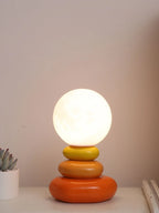 Lampe à poser en céramique galets empilés et globe lune, 24 cm