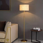 Lampadaire télescopique doré, abat-jour tambour en lin beige