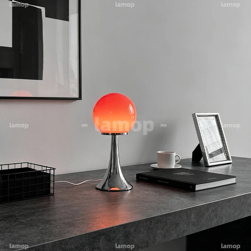 Lampe à poser boule de verre colorée sur pied tulipe chromé