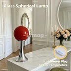 Lampe à poser boule de verre colorée sur pied tulipe chromé