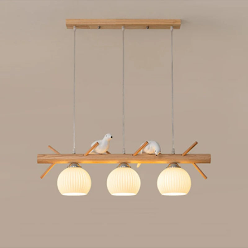 Lustre branche en bois à oiseaux et 3 globes en verre côtelé blanc