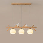Lustre branche en bois à oiseaux et 3 globes en verre côtelé blanc