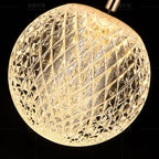 Suspension LED globe transparent à facettes losange, finition dorée