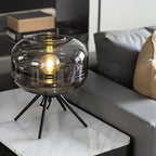 Lampe à poser en verre fumé ou cognac sur piétement noir, 37 cm