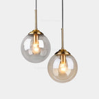 Petite suspension globe en verre Ø 15 cm, tube doré, câble 80 cm