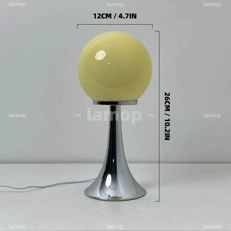 Lampe à poser boule de verre colorée sur pied tulipe chromé