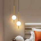 Suspension de chevet LED, globe Ø 10 cm sur tige, dorée ou noire
