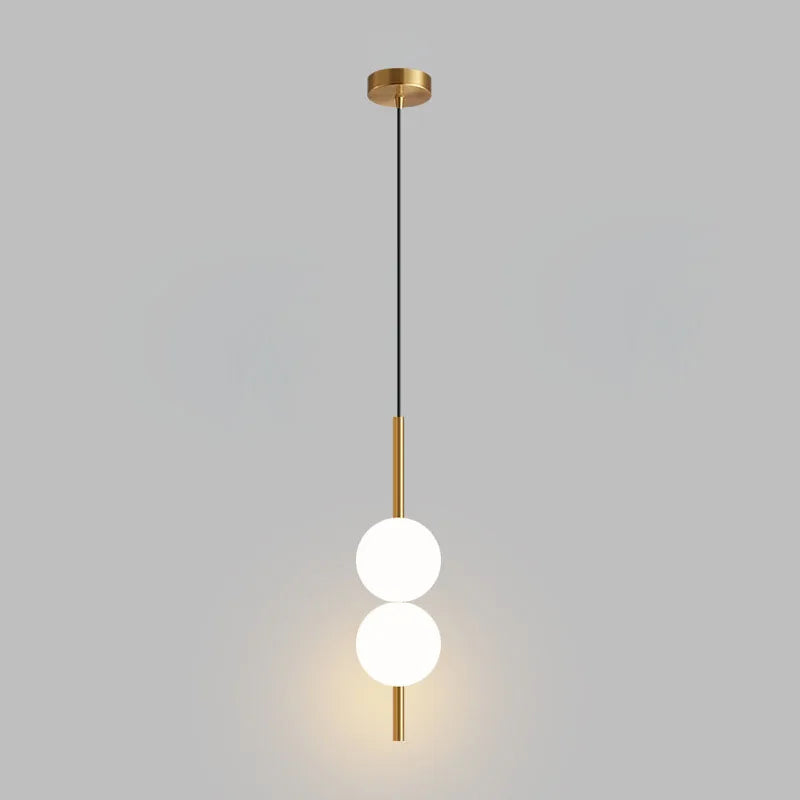 Suspension de chevet LED, globe Ø 10 cm sur tige, dorée ou noire