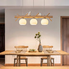 Lustre branche en bois à oiseaux et 3 globes en verre côtelé blanc