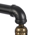Lampe à poser industrielle en tuyaux de fer noir, cage et socle bois