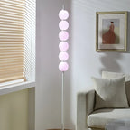 Lampadaire LED à boules acryliques pastel, empilées comme des bonbons
