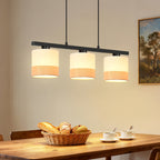 Suspension 3 abat-jour en tissu blanc sur barre noire de 58 cm