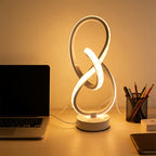 Lampe à poser blanche en ruban LED noué, sculpture lumineuse