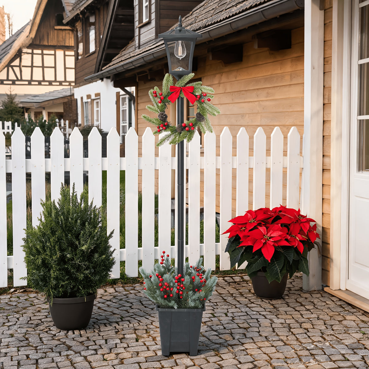 Lampadaire solaire de Noël orné d'une couronne de sapin