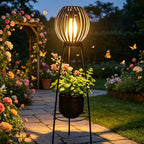 Lampadaire solaire rétro à boule ajourée sur trépied porte-fleurs