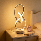 Lampe à poser blanche en ruban LED noué, sculpture lumineuse