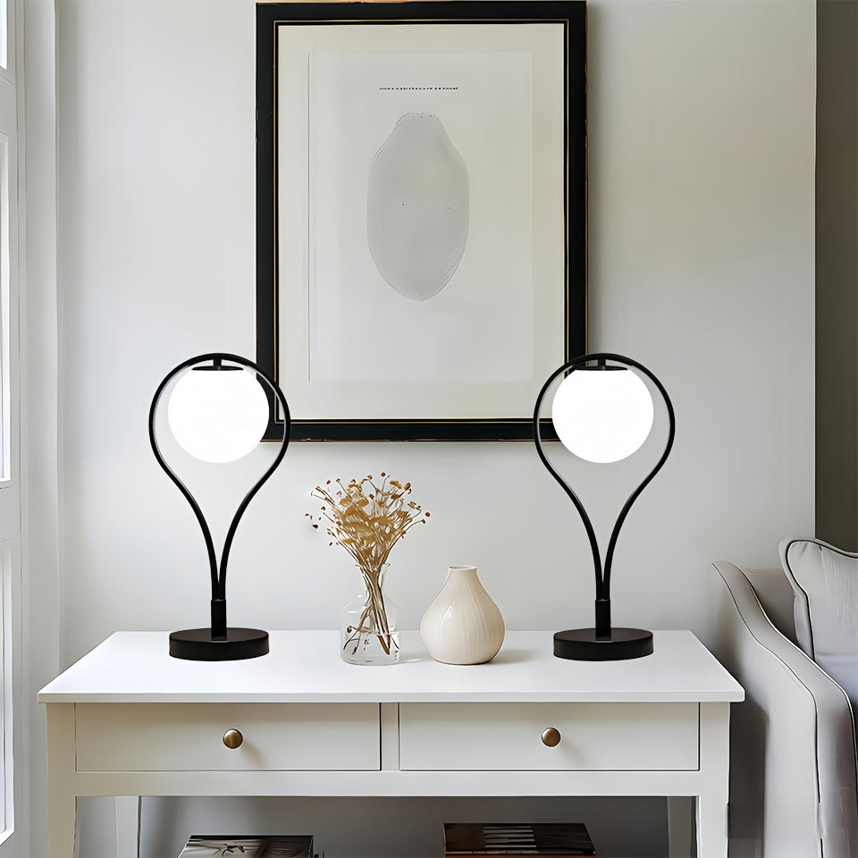Lampe de chevet noire, globe en verre opalin dans un arceau