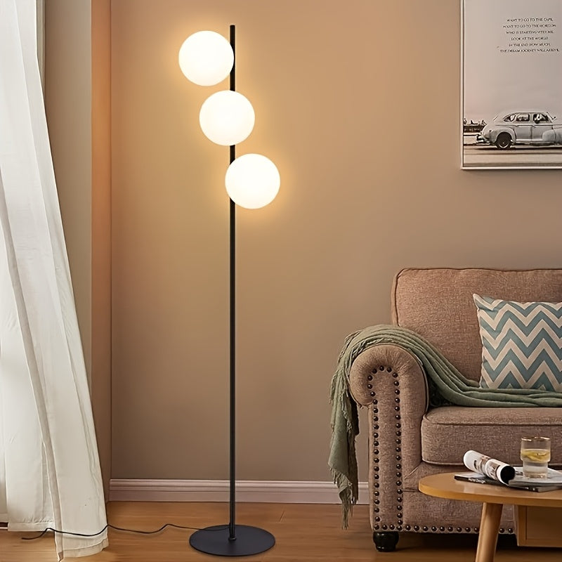 Lampadaire trois boules de verre blanc en cascade, pied doré