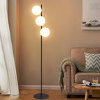 Lampadaire trois boules de verre blanc en cascade, pied doré