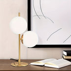 Lampe de chevet à deux globes en verre opalin, pied doré ou noir